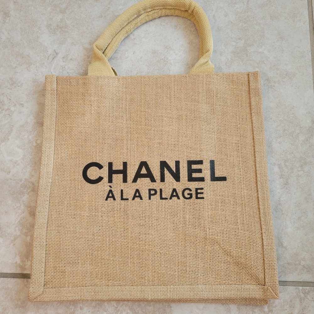 CHANEL A La Plage Beige Tote with Black Lettering